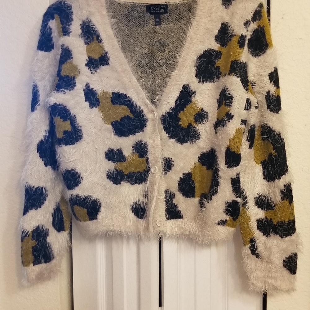 Animal print, shag sweater w/ front button closure